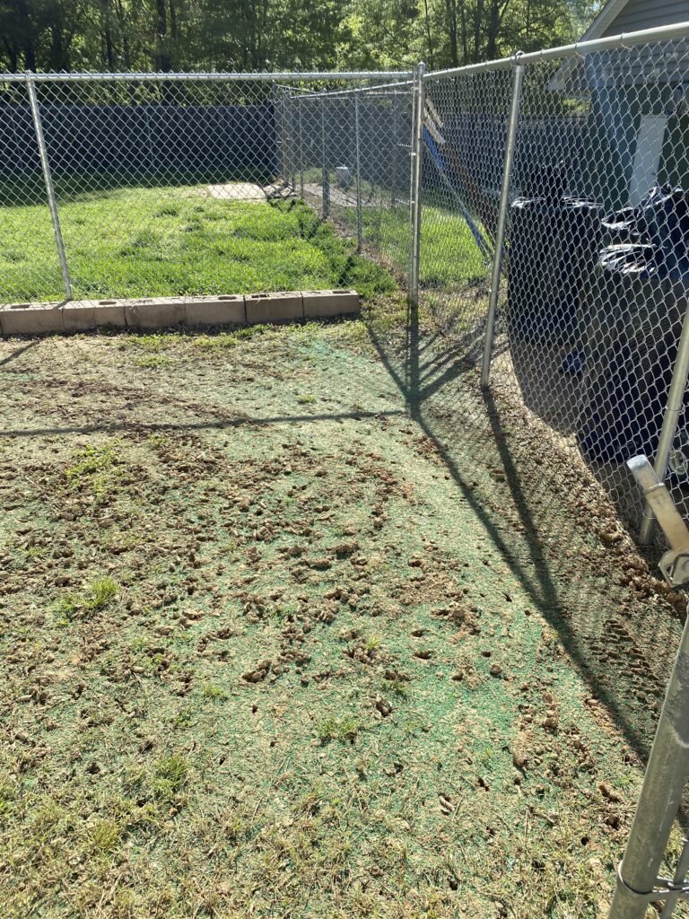 Destination Pet Kennel with muddy yard before Natura Turf installation. The team started by prepping the ground.